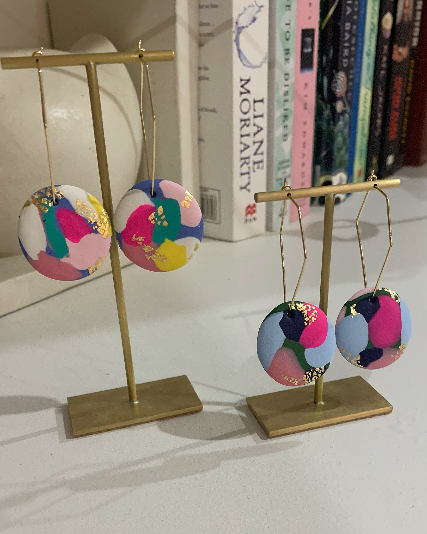 Clay discs with gold foil on angled wire hoop